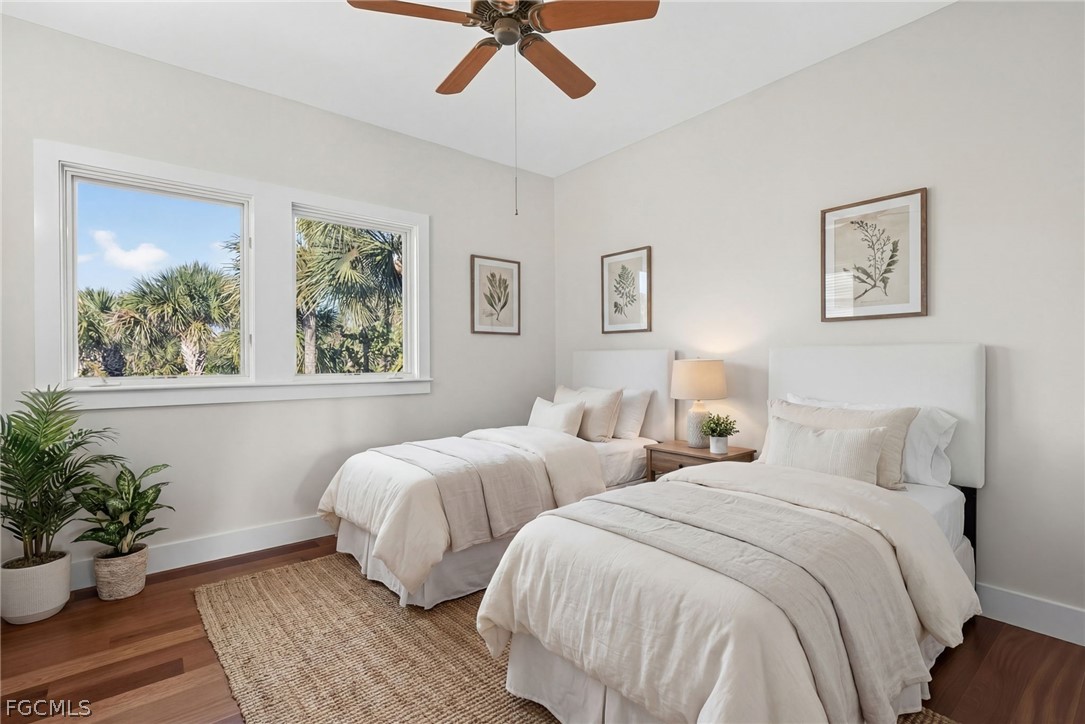 5703 Sanibel Captiva Road Sanibel, FL 33957 - Photo 32 of 50 a bedroom with two beds and potted plant
