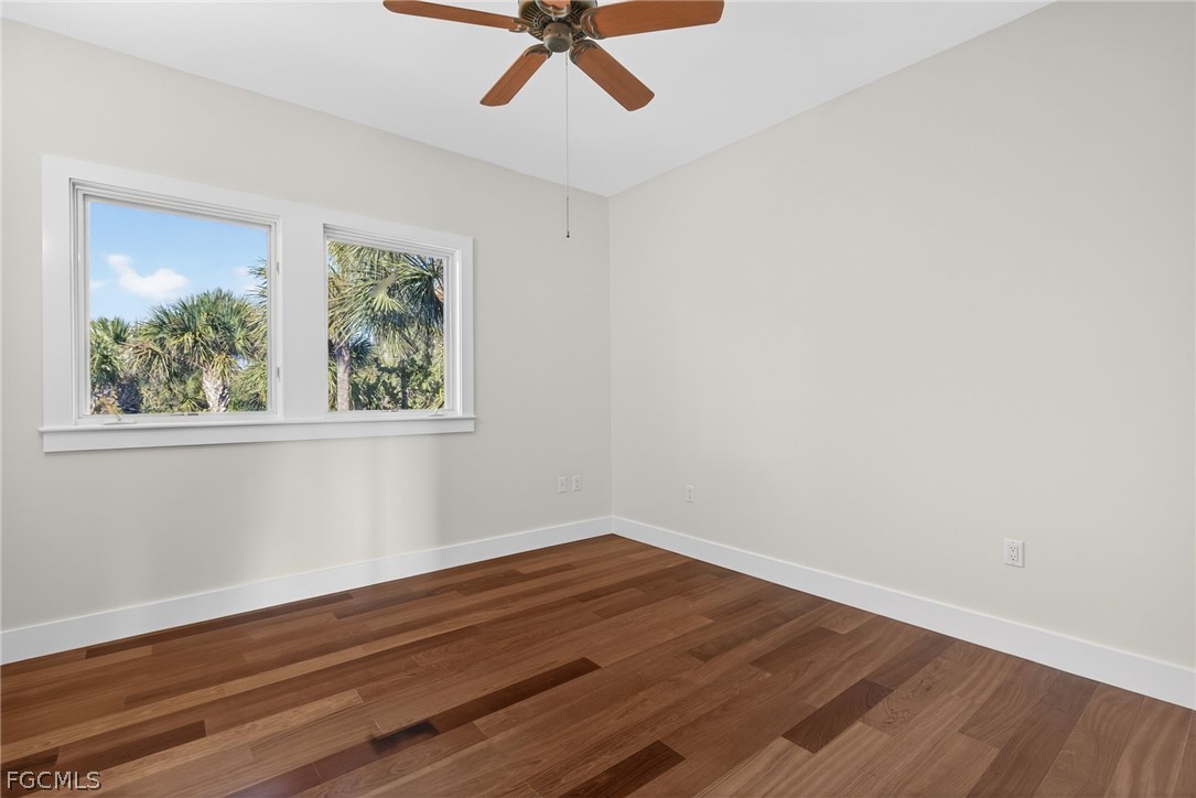 5703 Sanibel Captiva Road Sanibel, FL 33957 - Photo 33 of 50 a view of a room with wooden floor and windows