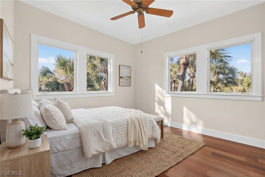5703 Sanibel Captiva Road Sanibel, FL 33957 - Photo 35 of 50 a bedroom with a large bed and a window