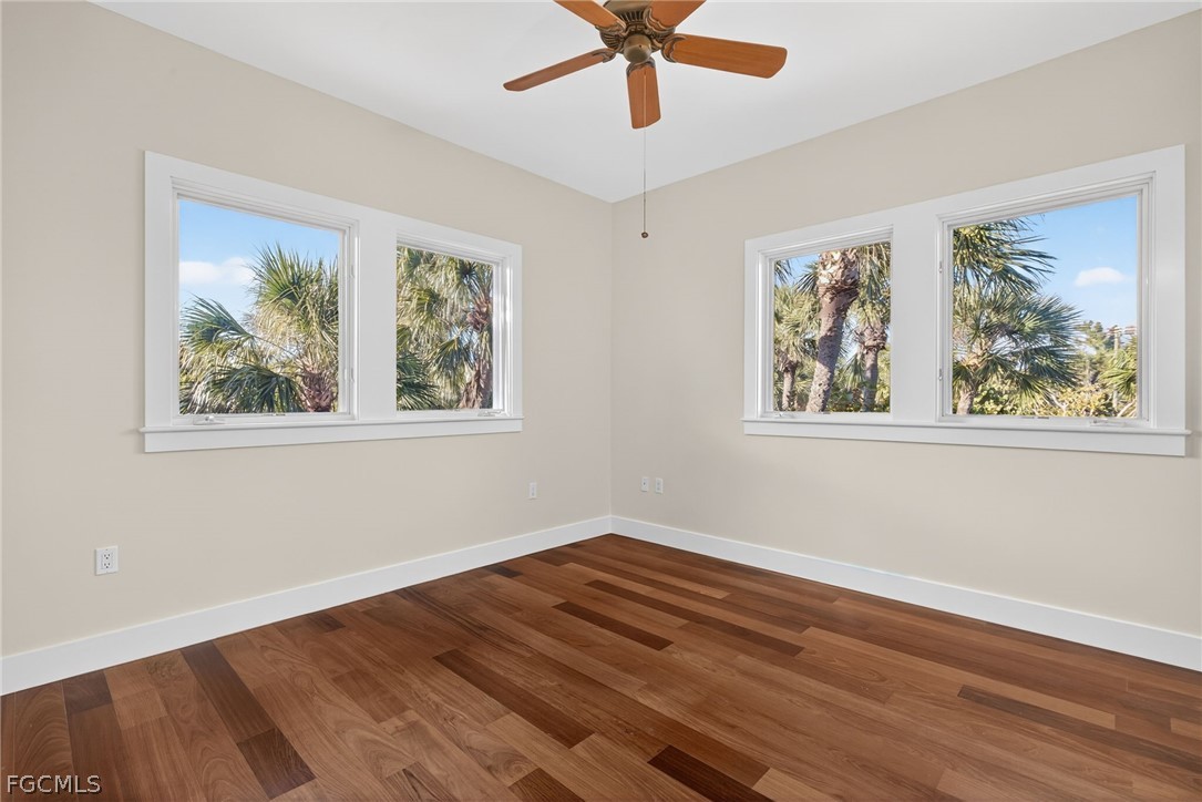 5703 Sanibel Captiva Road Sanibel, FL 33957 - Photo 36 of 50 a view of empty room with wooden floor