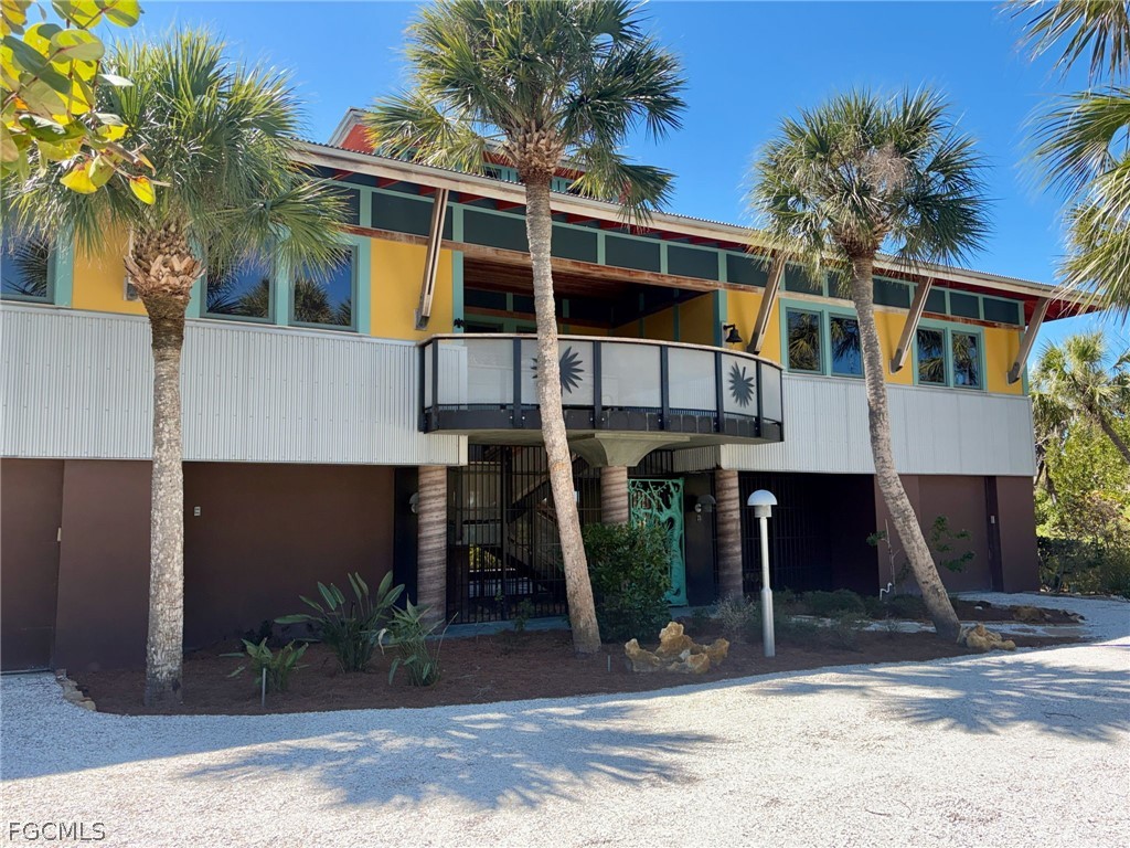 5703 Sanibel Captiva Road Sanibel, FL 33957 - Photo 39 of 50 a front view of a house with garden