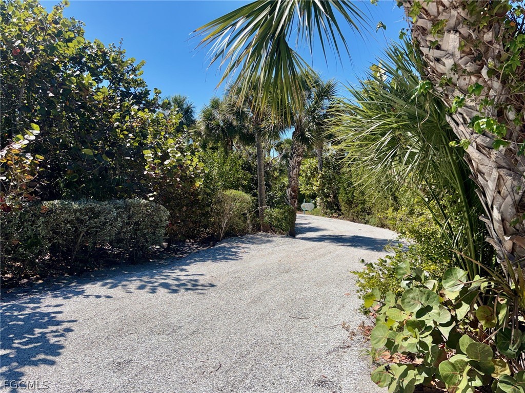 5703 Sanibel Captiva Road Sanibel, FL 33957 - Photo 40 of 50 a view of a yard with plants and trees