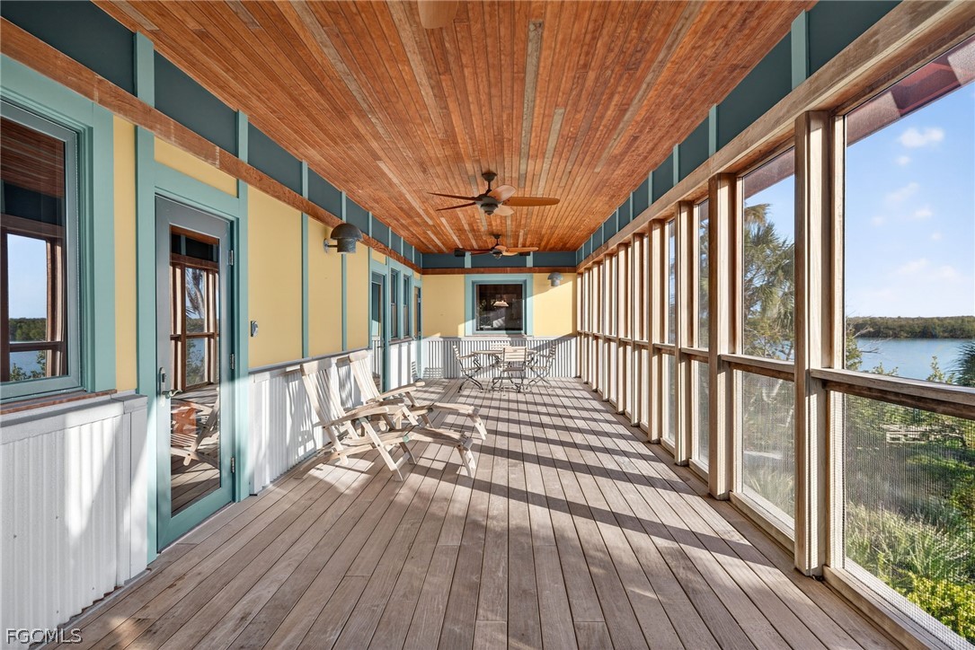 5703 Sanibel Captiva Road Sanibel, FL 33957 - Photo 4 of 50 a view of a balcony with wooden floor