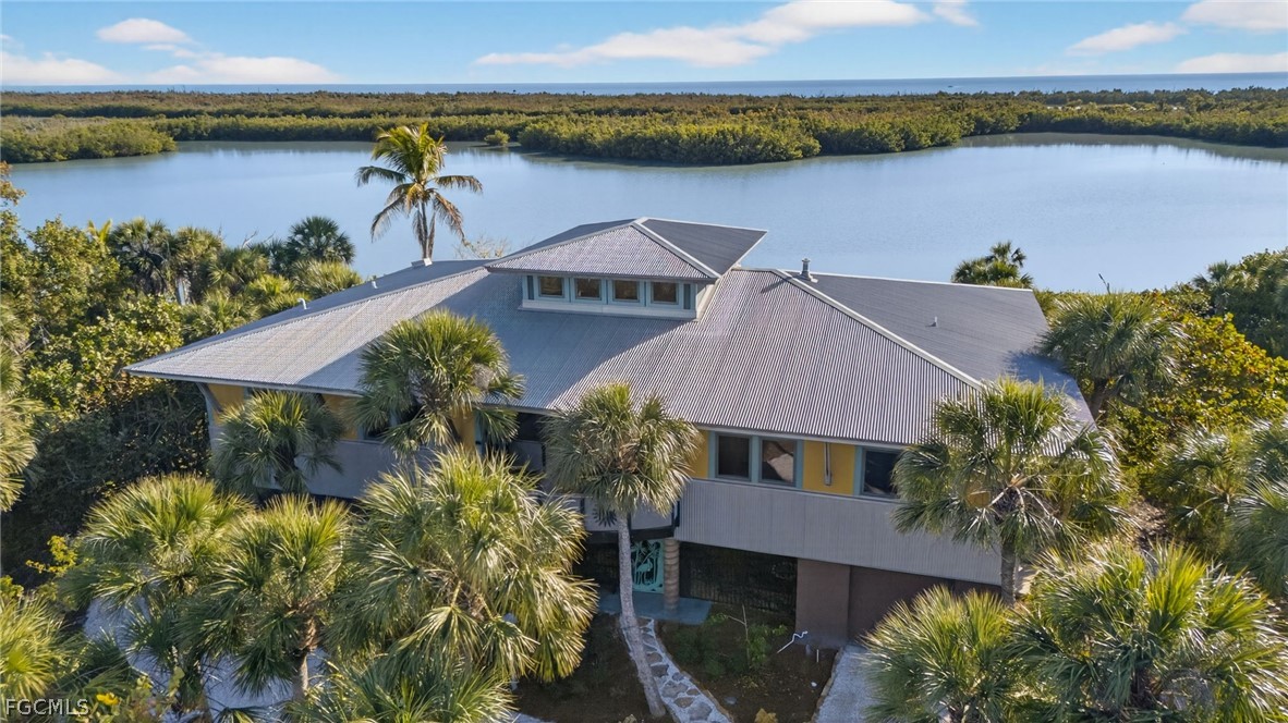 5703 Sanibel Captiva Road Sanibel, FL 33957 - Photo 41 of 50 a aerial view of a house with a lake view