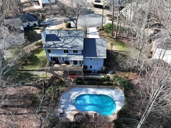 a backyard of a house with yard and outdoor seating