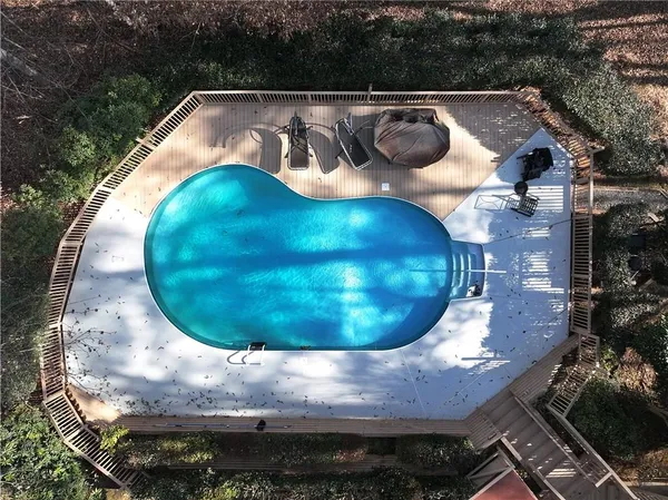 an aerial view of a house with outdoor space