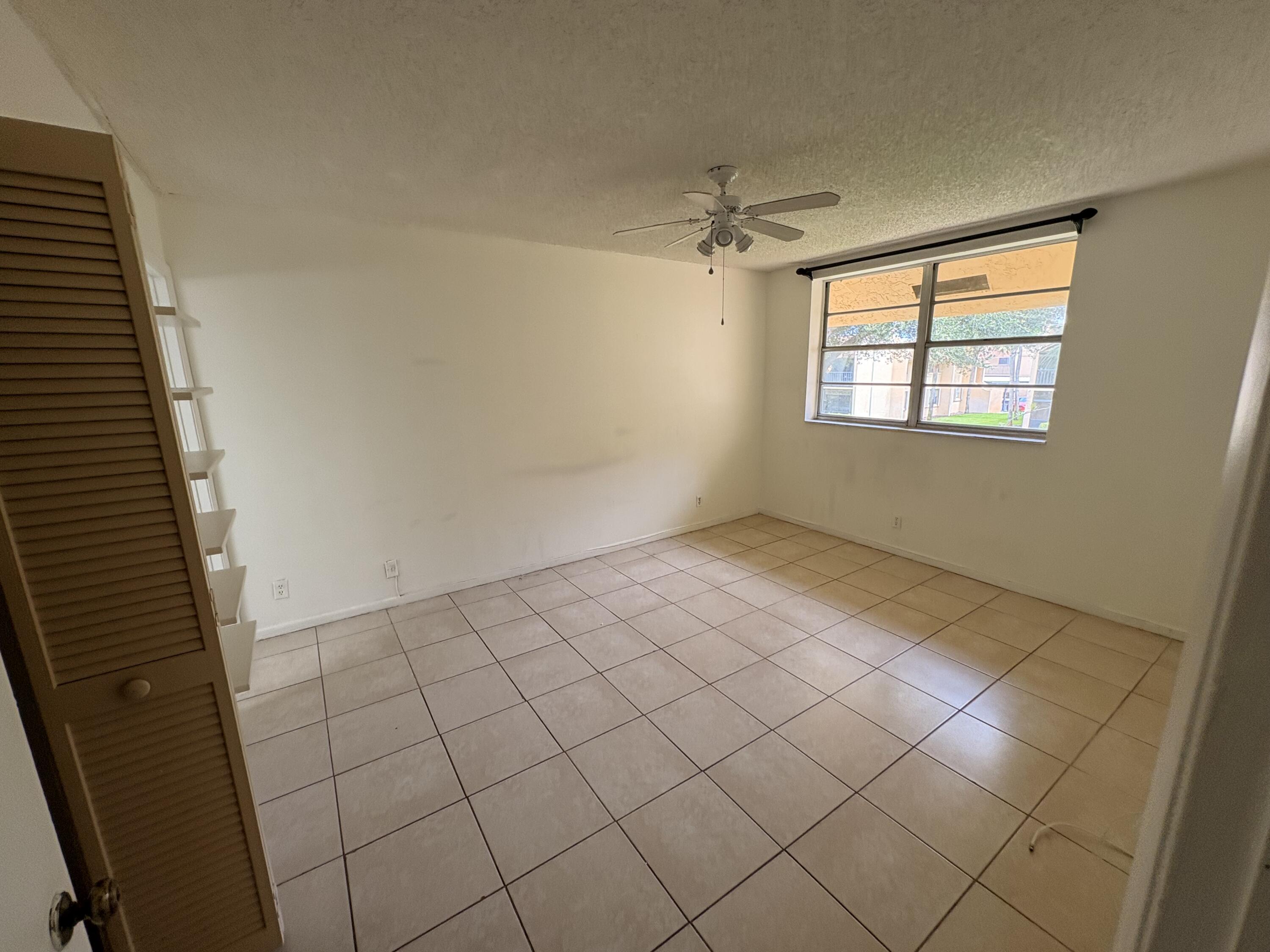 2925 Southwest 22nd Avenue, Unit 202 Delray Beach, FL 33445 - Photo 13 of 14 a view of an empty room and window