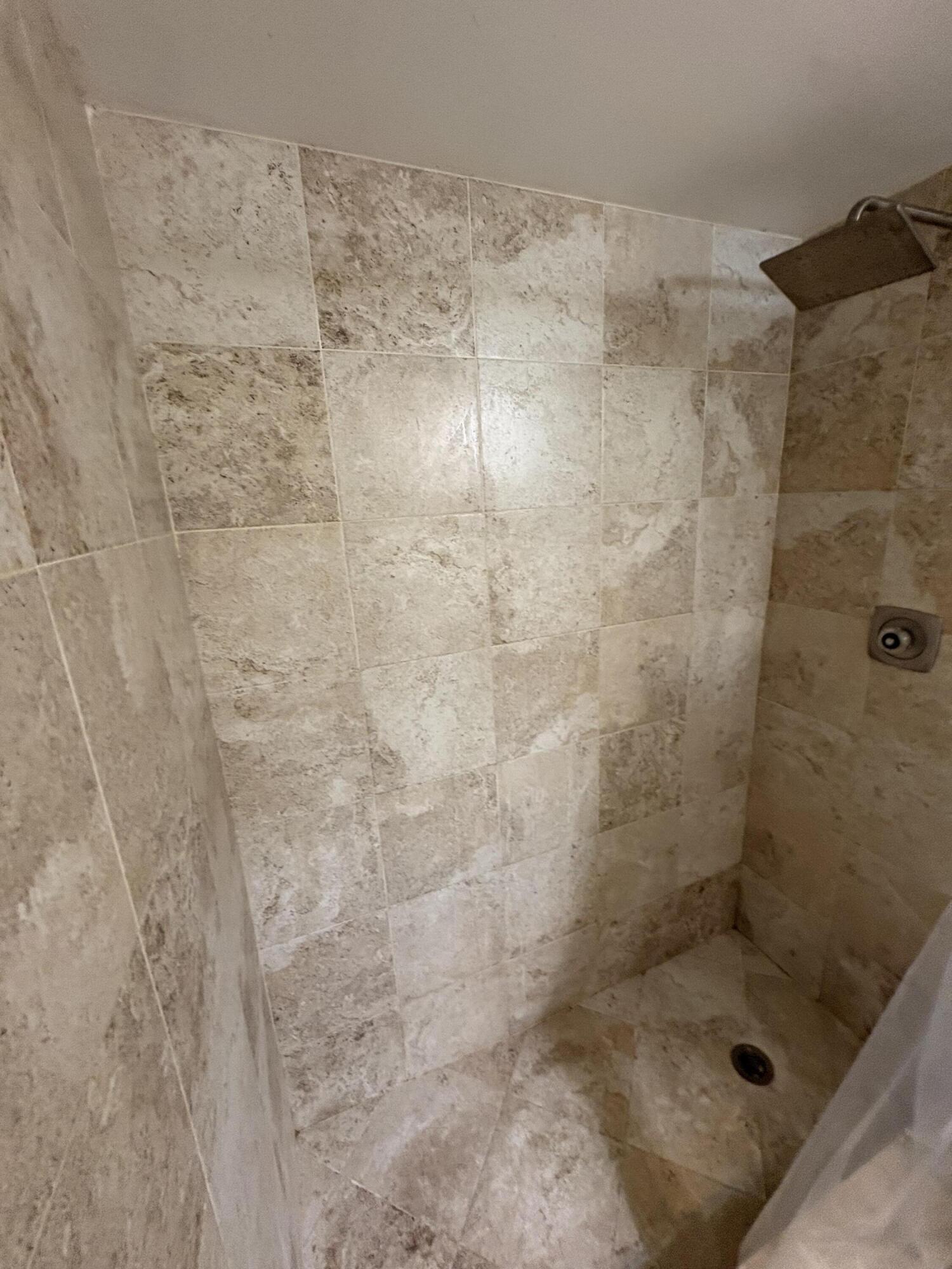 2925 Southwest 22nd Avenue, Unit 202 Delray Beach, FL 33445 - Photo 5 of 14 a bathroom with a shower