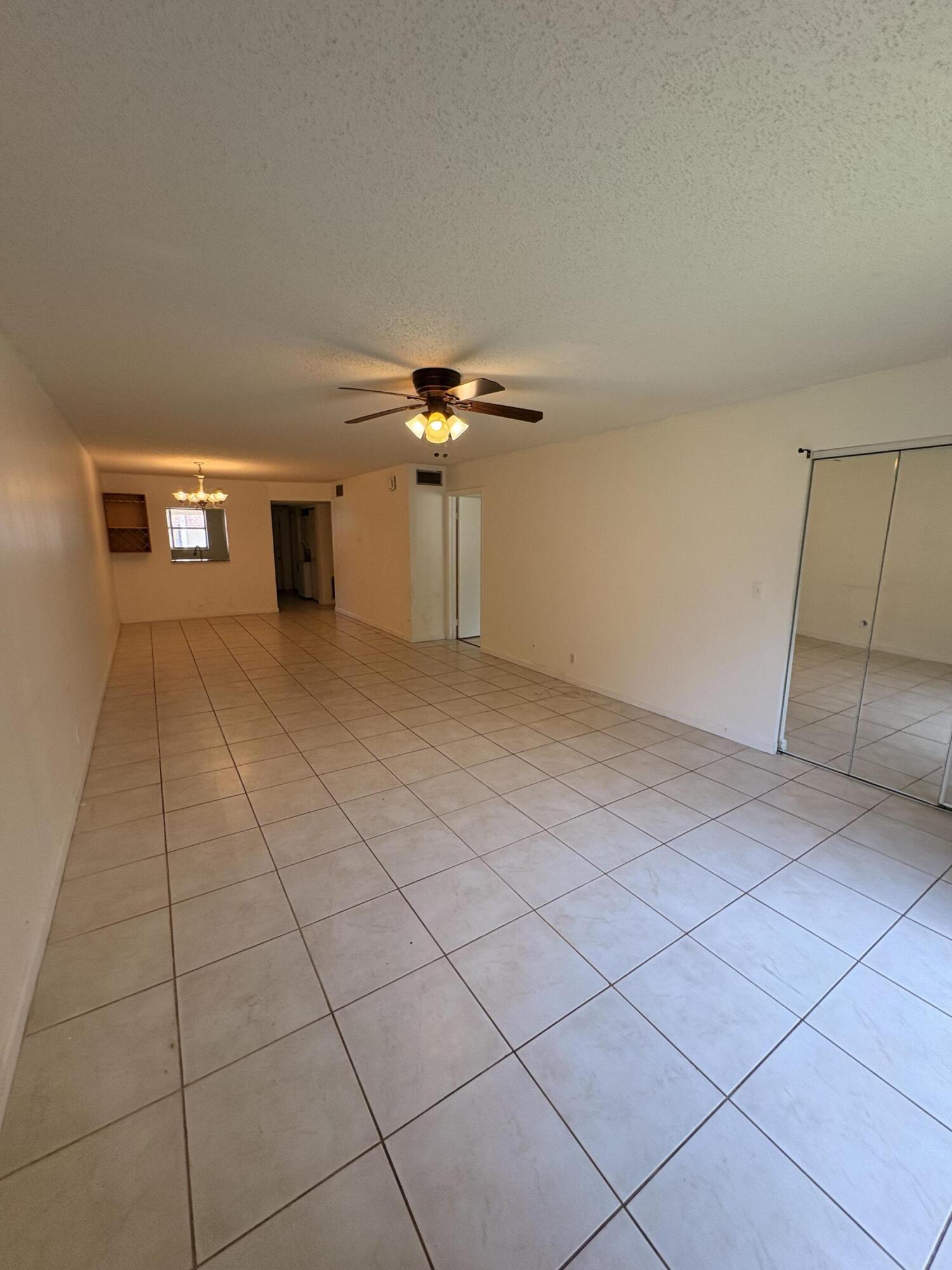 2925 Southwest 22nd Avenue, Unit 202 Delray Beach, FL 33445 - Photo 7 of 14 a view of an empty room with a window