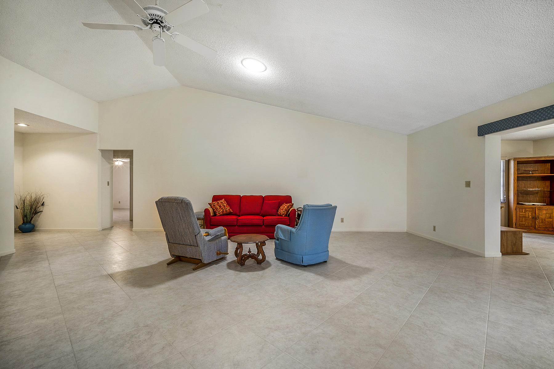 7818 Cloverfield Circle Boca Raton, FL 33433 - Photo 7 of 36 Living Room w/ Neutral Tile