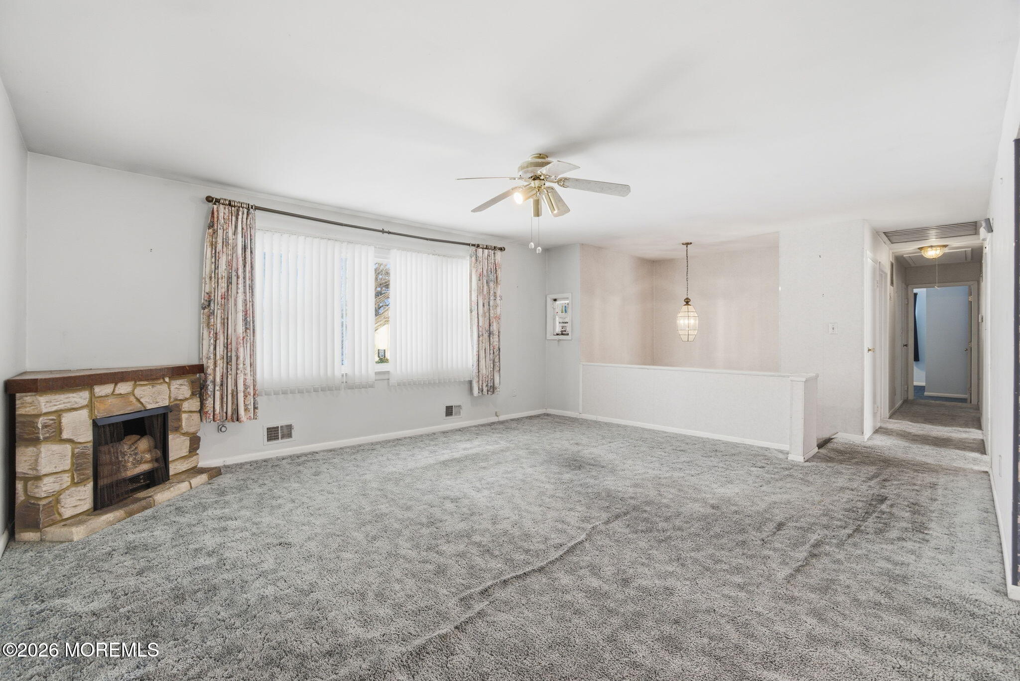 708 Auth Avenue Oakhurst, NJ 07755 - Photo 12 of 29 a view of an empty room with a fireplace and a window