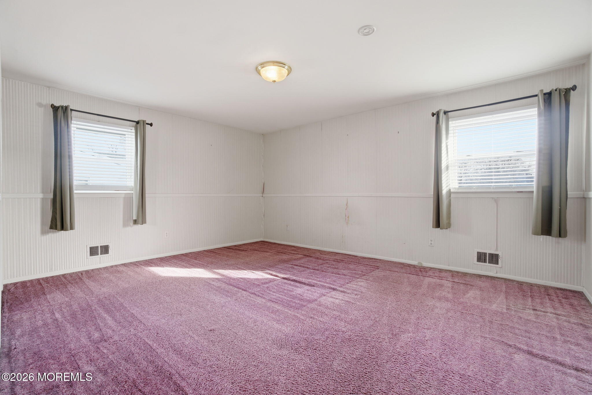 708 Auth Avenue Oakhurst, NJ 07755 - Photo 2 of 29 an empty room with windows