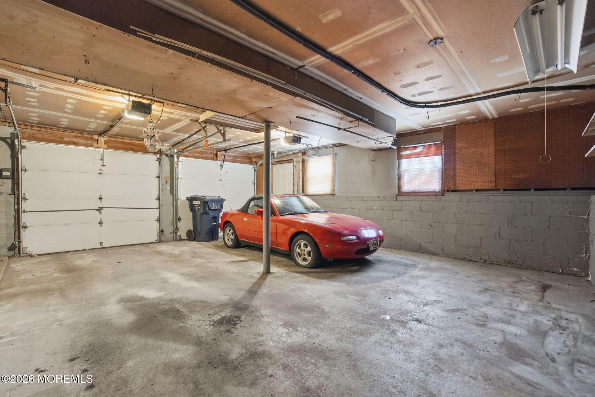 708 Auth Avenue Oakhurst, NJ 07755 - Photo 22 of 29 a view of parking garage with cars
