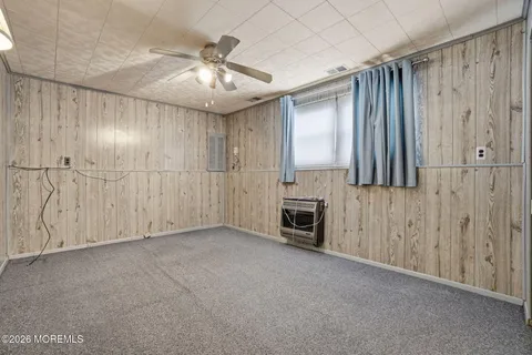 a view of a livingroom with a kitchen
