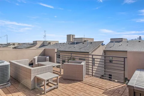 a terrace with a table and chairs