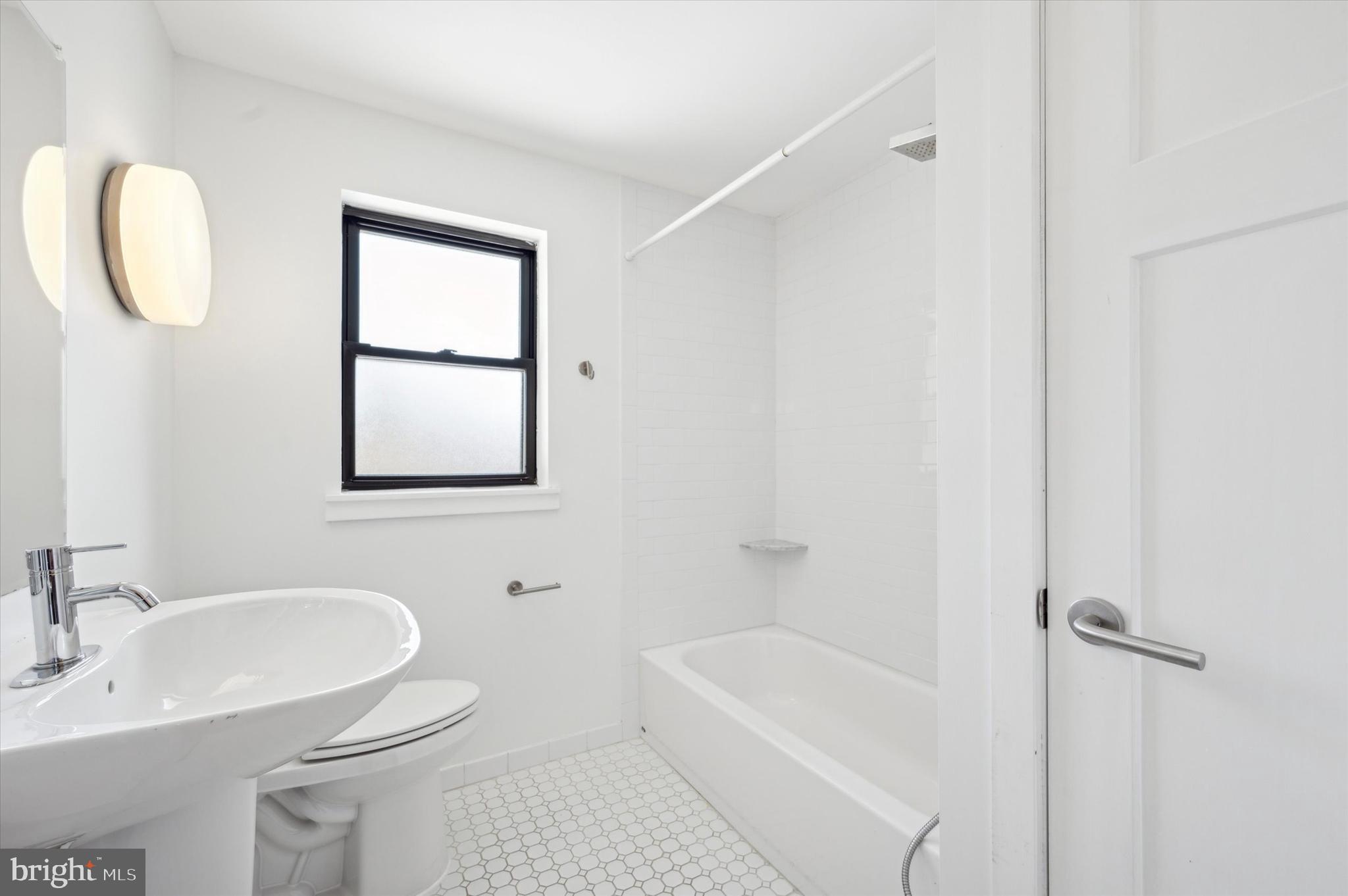 29 Rolling Road Wynnewood, PA 19096 - Photo 21 of 25 a bathroom with a toilet a sink and mirror
