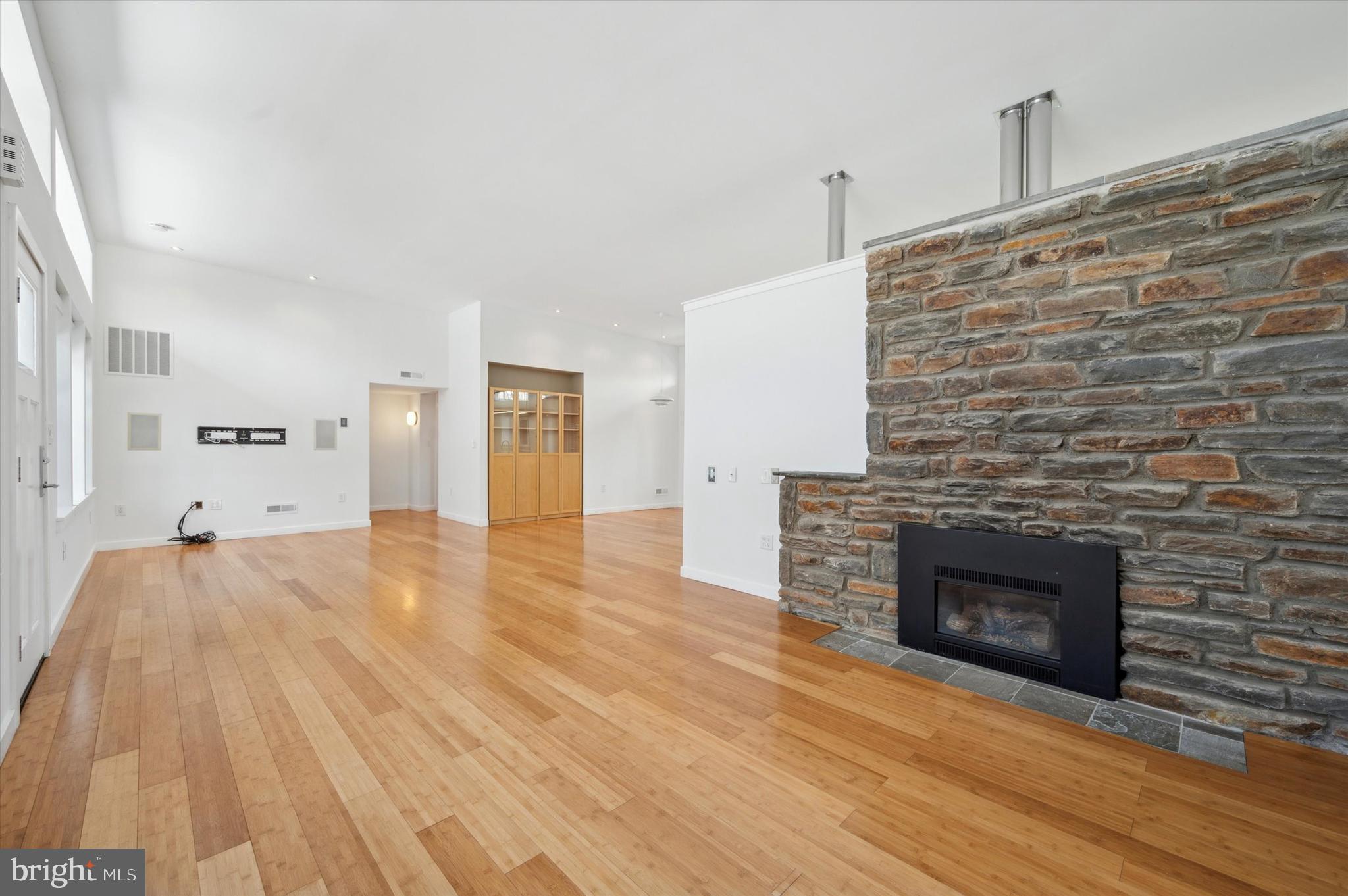 29 Rolling Road Wynnewood, PA 19096 - Photo 3 of 25 a view of empty room with wooden floor and fireplace