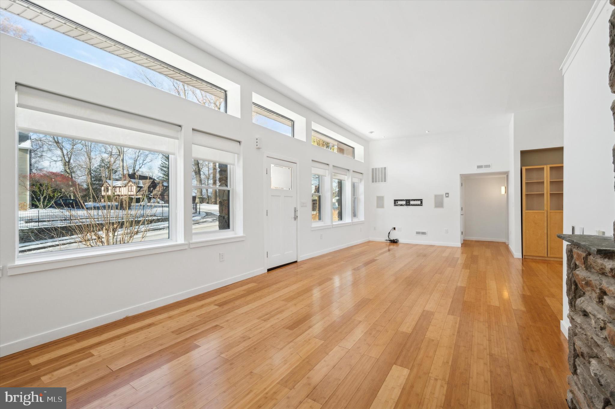 29 Rolling Road Wynnewood, PA 19096 - Photo 5 of 25 a view of empty room with wooden floor and fan