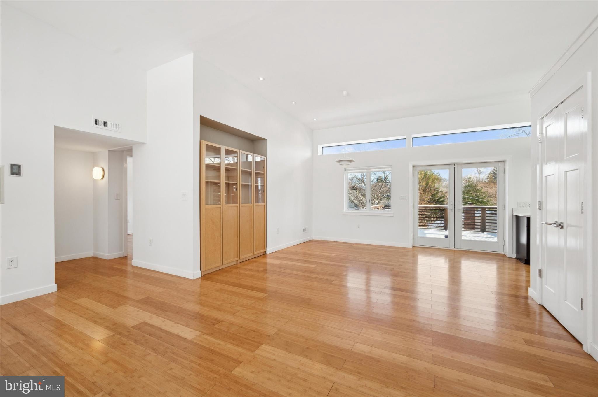 29 Rolling Road Wynnewood, PA 19096 - Photo 6 of 25 a view of an empty room with window and wooden floor