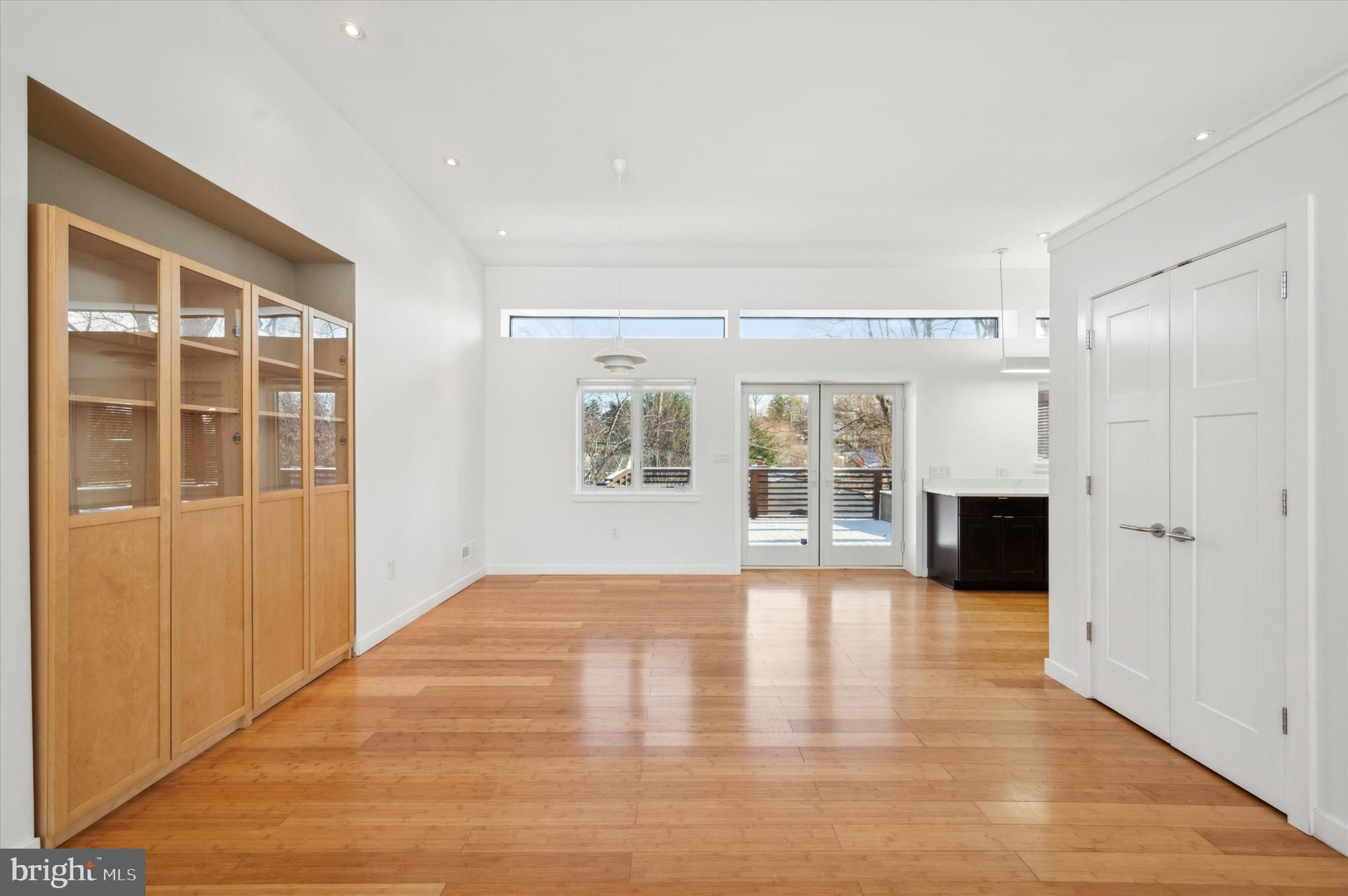 29 Rolling Road Wynnewood, PA 19096 - Photo 8 of 25 a view of an empty room with a window and wooden floor