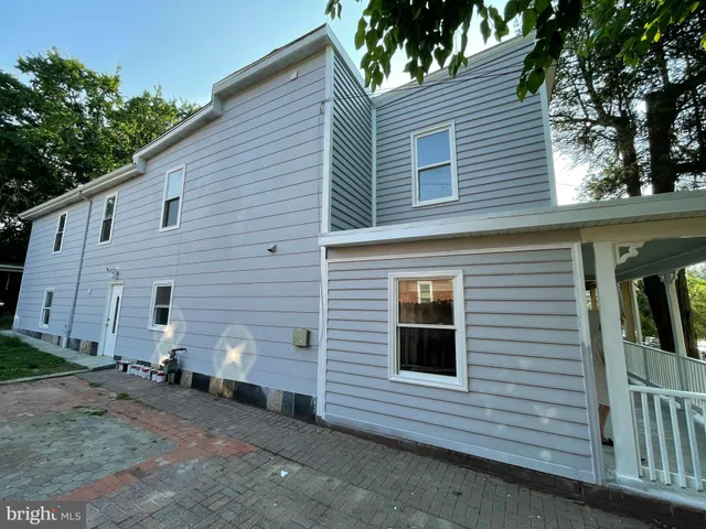 a view of a house with a yard and garage