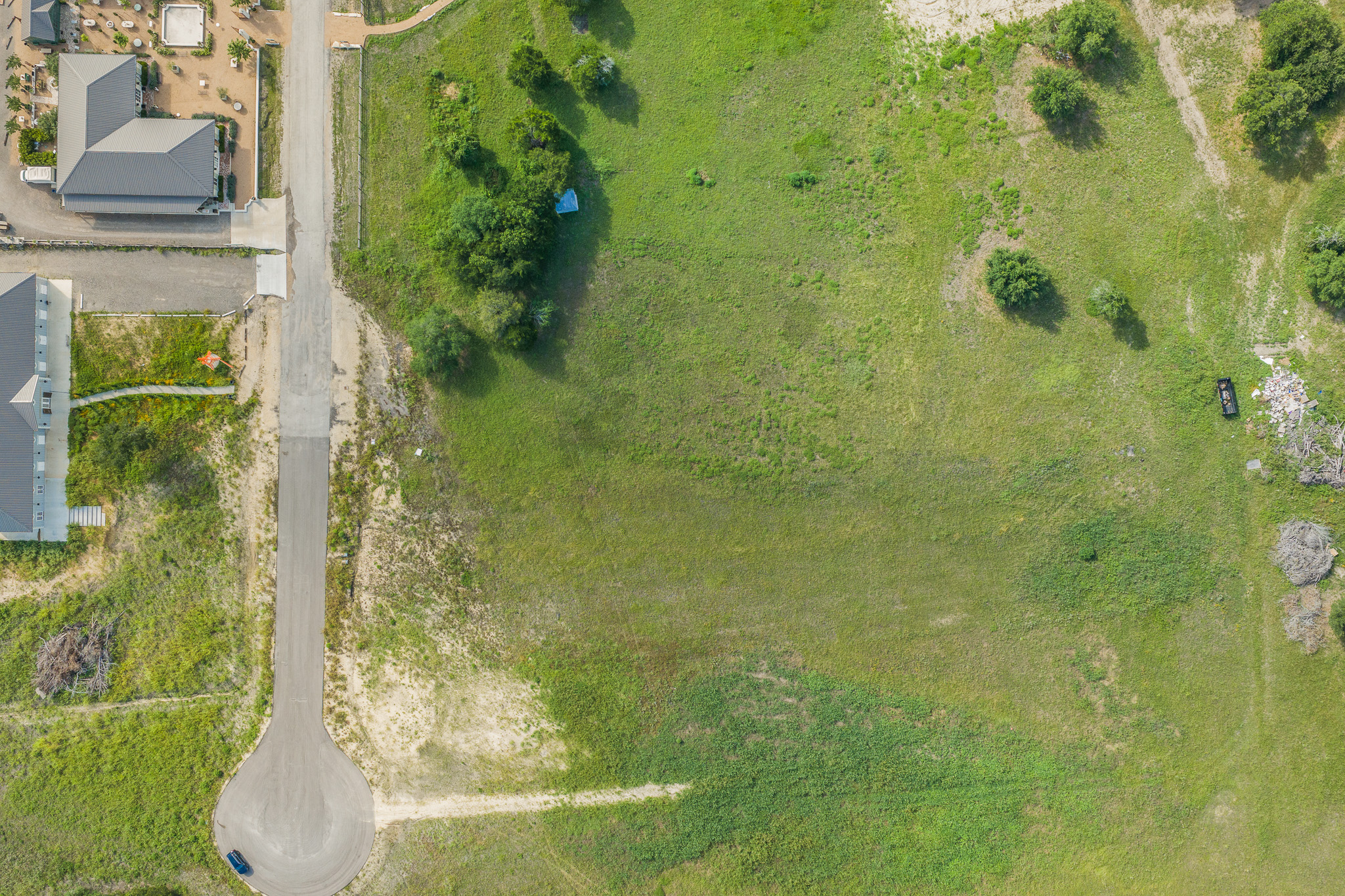 109 Compound Lane Round Top, TX 78954 - Photo 20 of 23 A spacious, verdant lot awaits your vision, bordered by a tranquil cul-de-sac and existing residences.