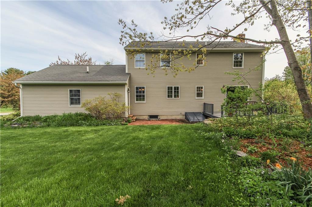 Rear view showing gardens, brick...
