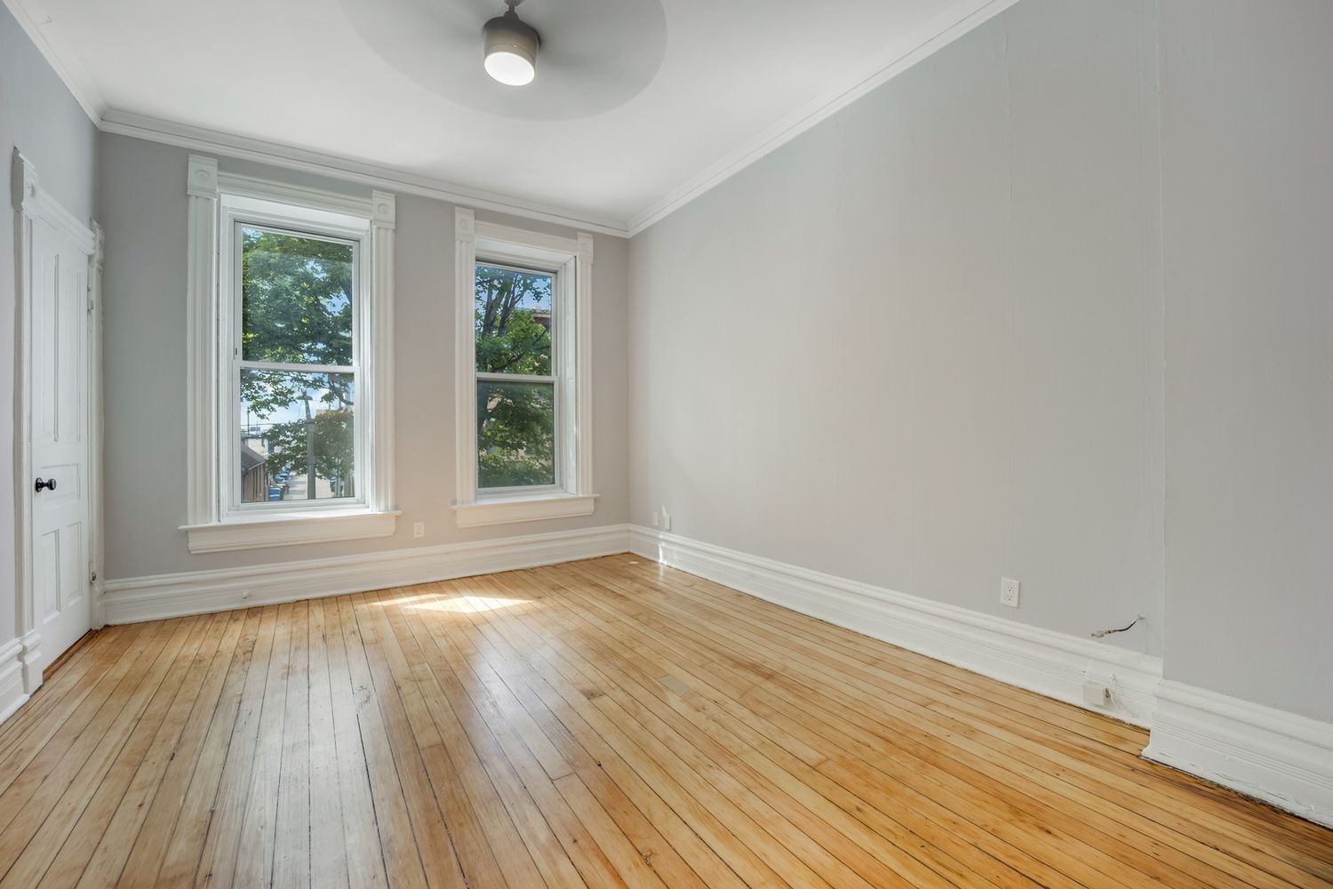 1346 West Webster Avenue, Unit 2F Chicago, IL 60614 - Photo 7 of 12 a view of an empty room with wooden floor and a window