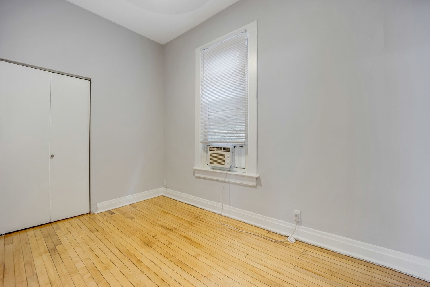 1346 West Webster Avenue, Unit 2F Chicago, IL 60614 - Photo 9 of 12 a view of an empty room with wooden floor and a window