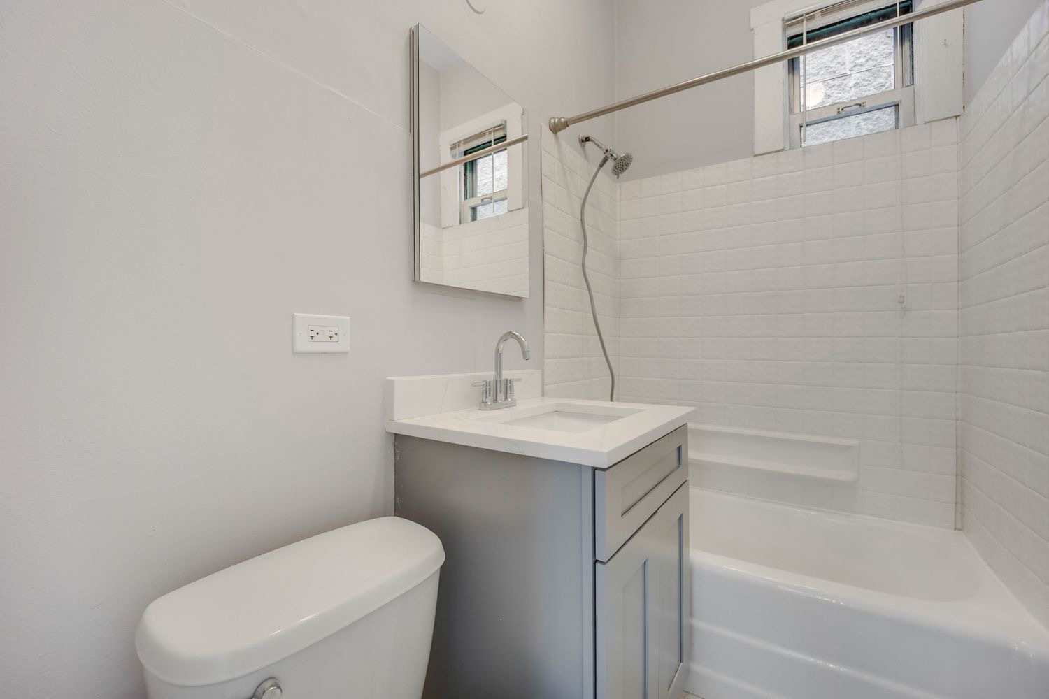 1346 West Webster Avenue, Unit 2F Chicago, IL 60614 - Photo 10 of 12 a bathroom with a sink a toilet and shower