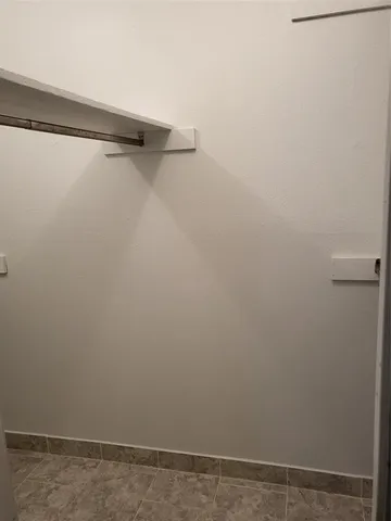 a view of a room with racks on the wall