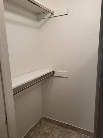 a kitchen with granite countertop a sink and a stove