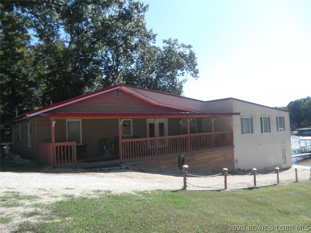Side view of the home featuring the covered deck a