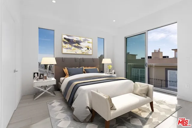 a bedroom with a bed and a painting on the wall