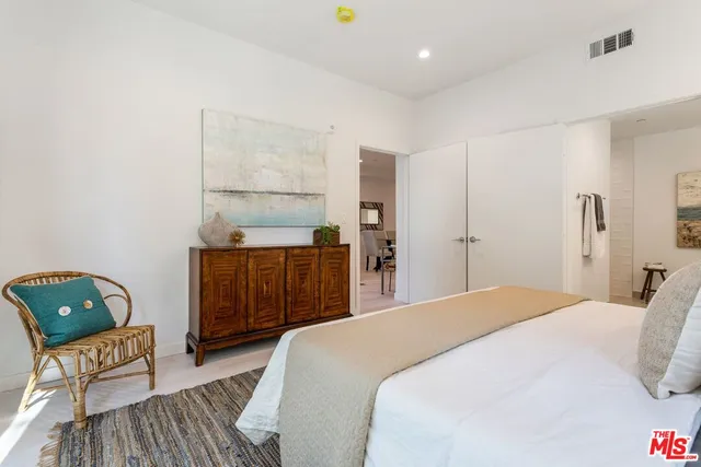 a bedroom with a bed and furniture