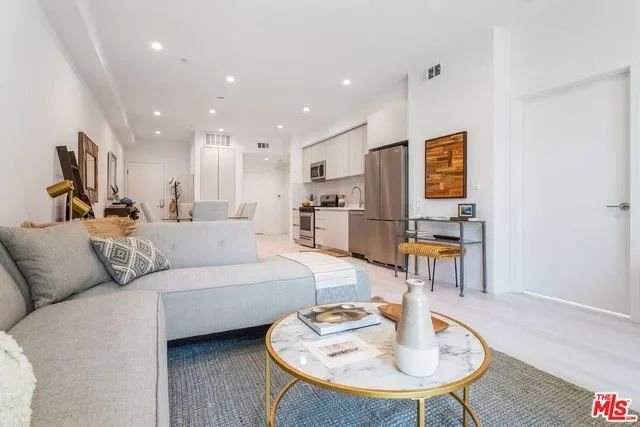 a living room with furniture and a table