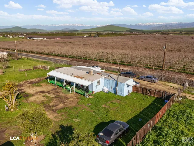 a view of a lake with houses in the back