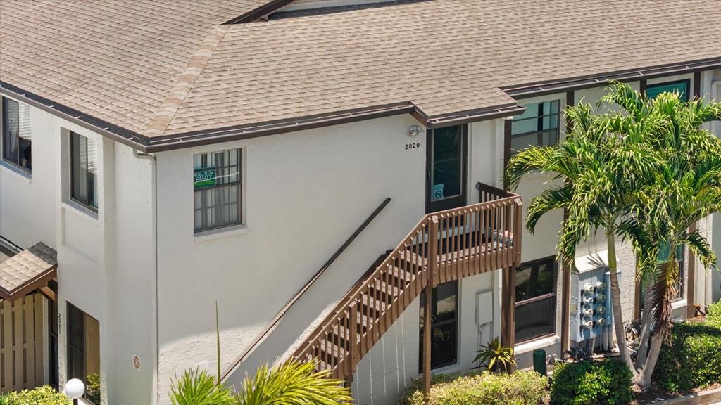 2829 74th Street West, Unit 2829 Bradenton, FL 34209 - Photo 1 of 27 a front view of a house with garden