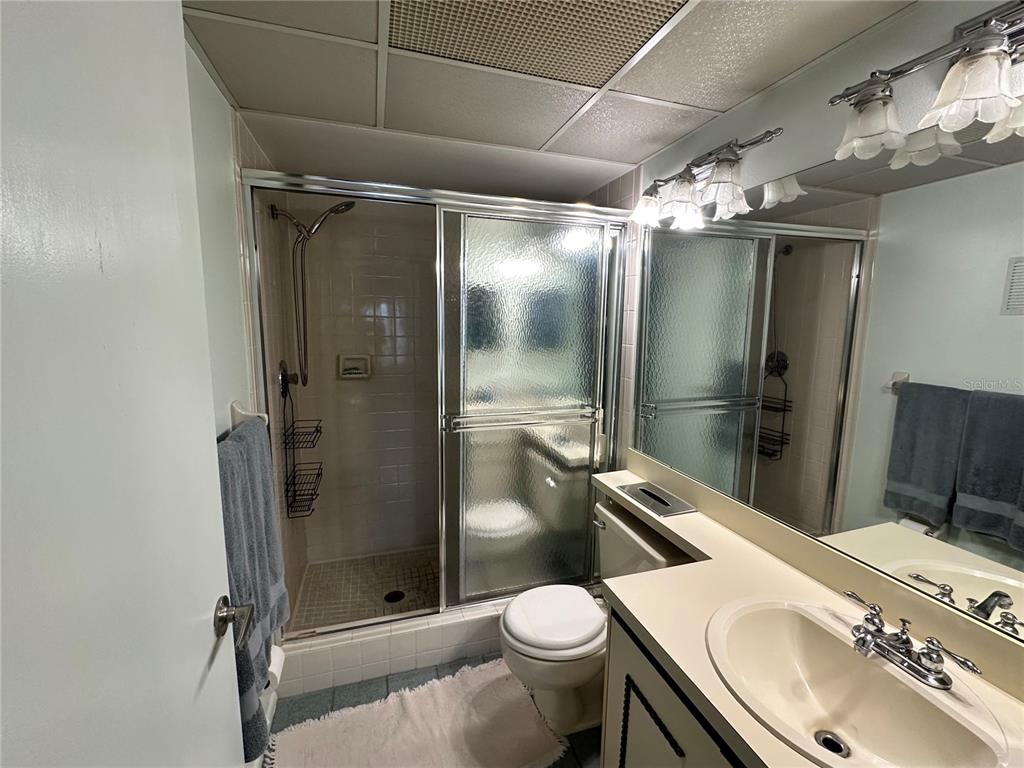 2829 74th Street West, Unit 2829 Bradenton, FL 34209 - Photo 13 of 27 a bathroom with a sink toilet and shower