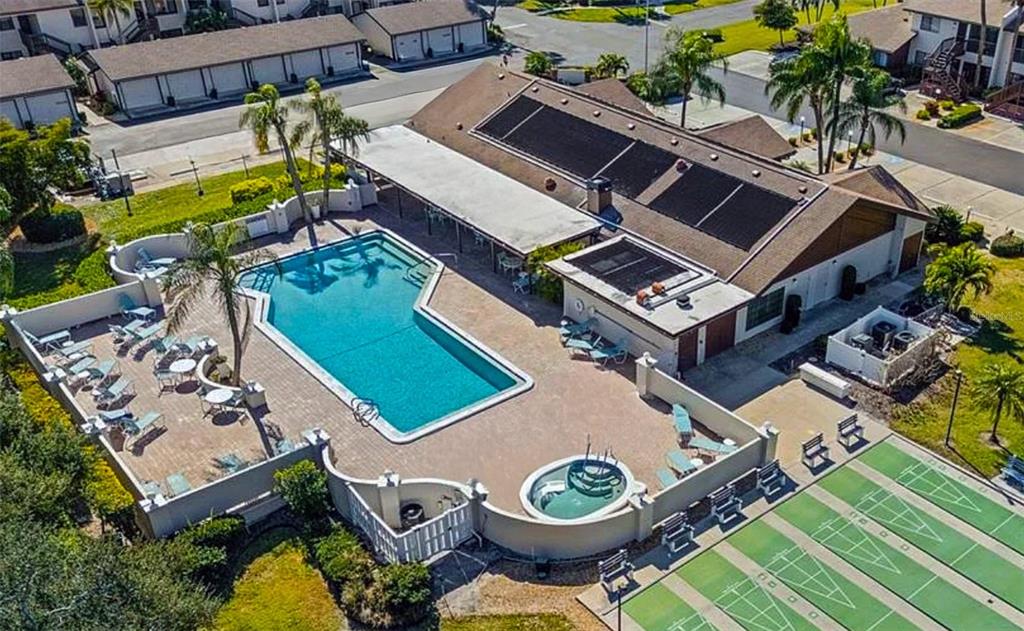 2829 74th Street West, Unit 2829 Bradenton, FL 34209 - Photo 17 of 27 an aerial view of a house with garden space and swimming pool