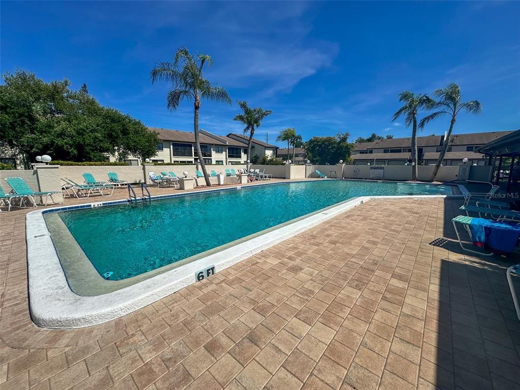 2829 74th Street West, Unit 2829 Bradenton, FL 34209 - Photo 18 of 27 a view of a backyard with sitting area