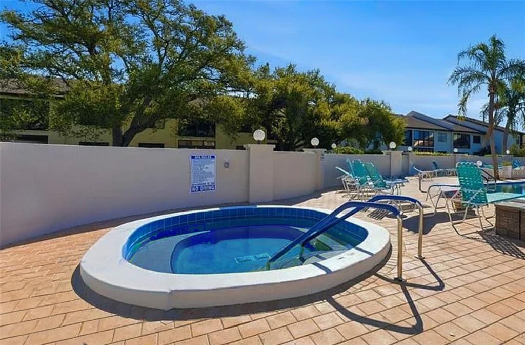 2829 74th Street West, Unit 2829 Bradenton, FL 34209 - Photo 19 of 27 a view of a swimming pool with a patio