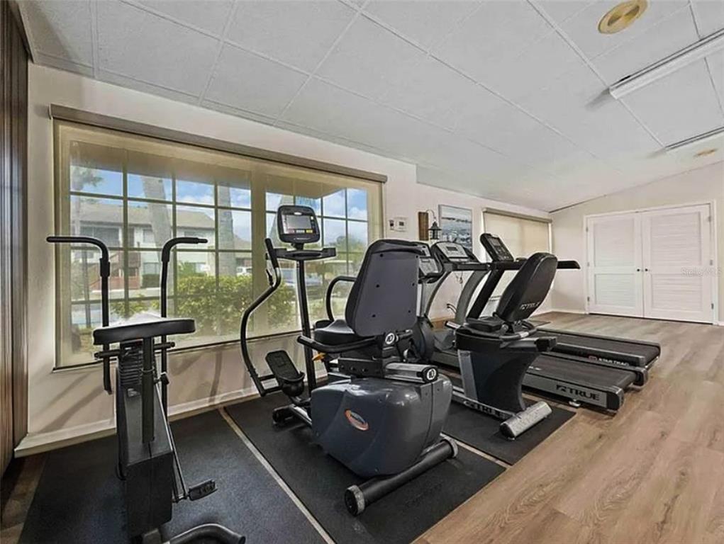 2829 74th Street West, Unit 2829 Bradenton, FL 34209 - Photo 21 of 27 a view of a room with gym equipment