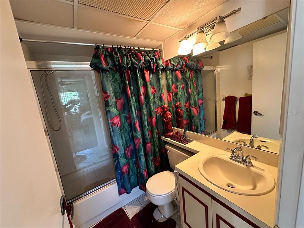 2829 74th Street West, Unit 2829 Bradenton, FL 34209 - Photo 10 of 27 a bathroom with a sink toilet and shower