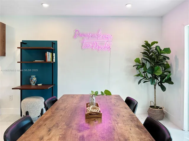 a bed room with a bed and a potted plant