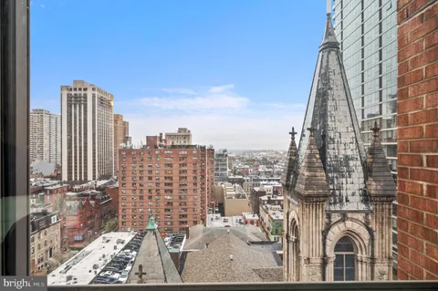 a view of a city with tall buildings