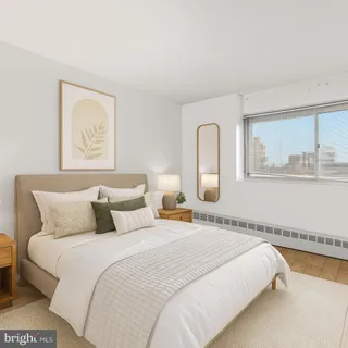 a bedroom with bed and window