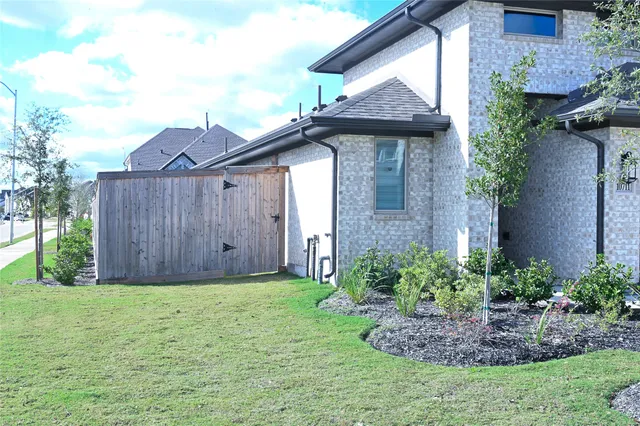 a view of a house with a yard and plants
