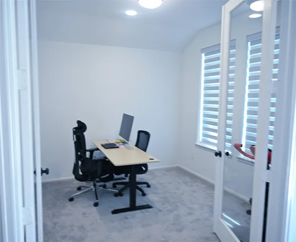 a workspace with furniture and a window
