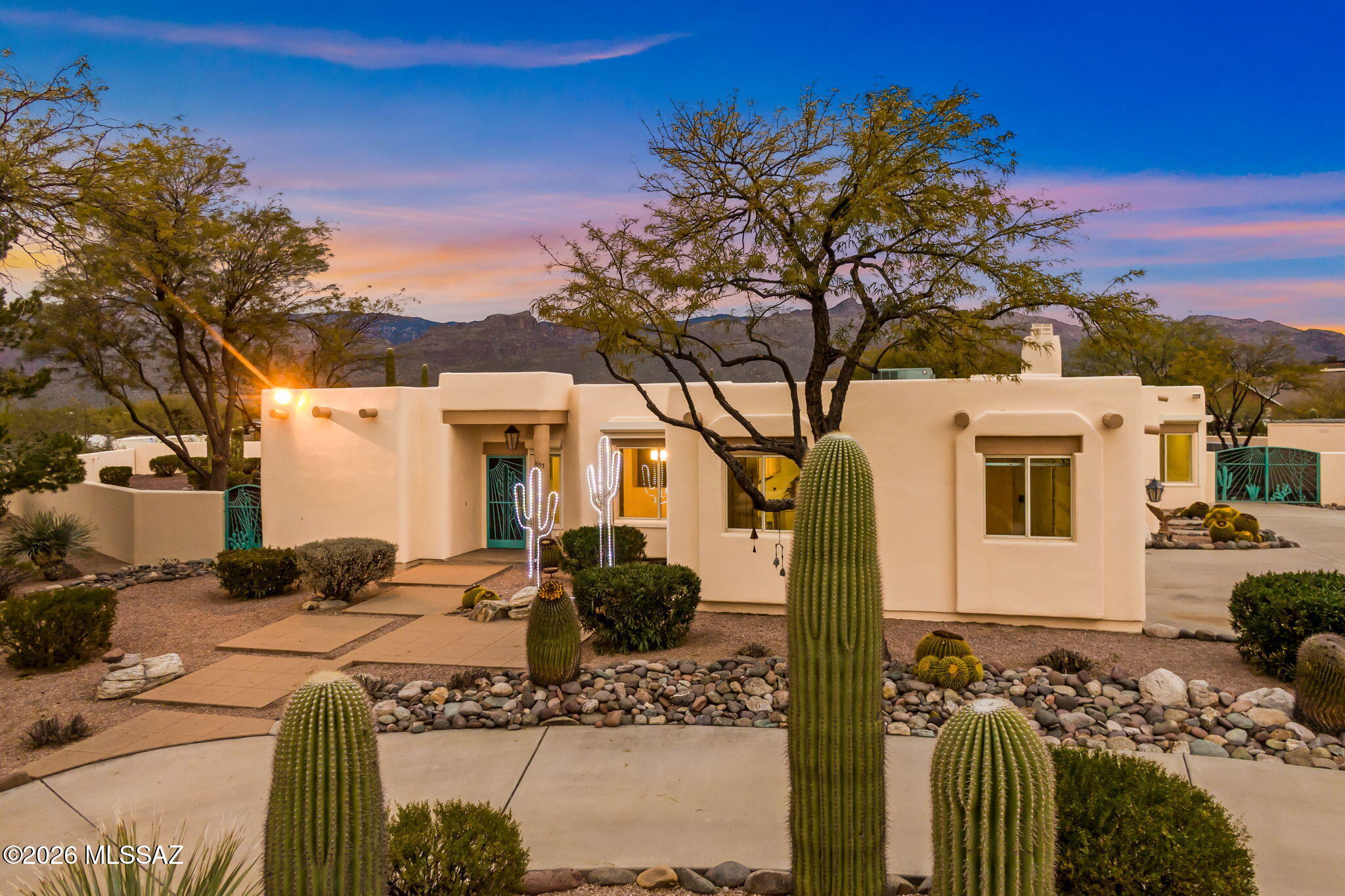 3655 North Harrison Road Tucson, AZ 85749 - Photo 5 of 51 a front view of a house with a yard